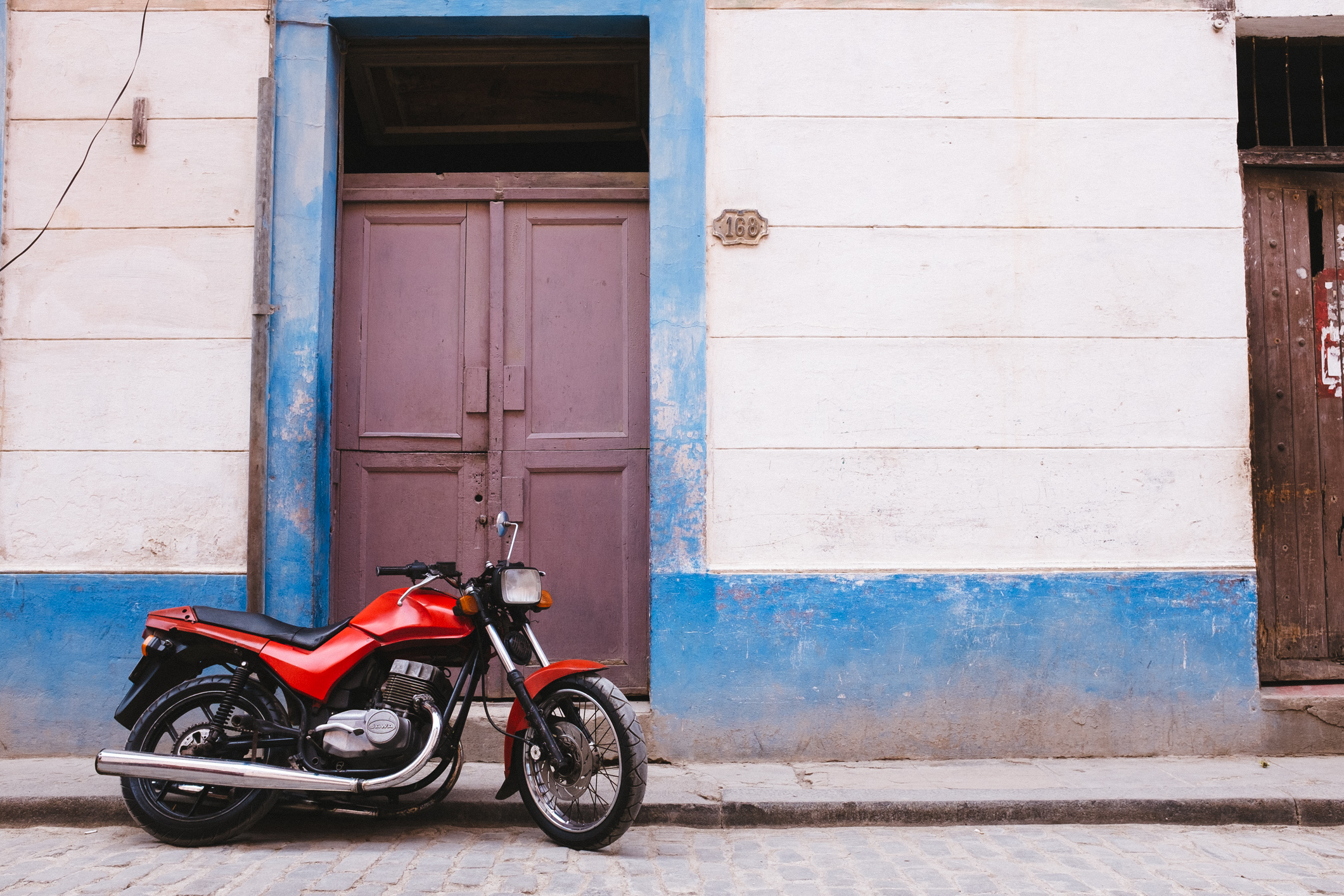 Red Style 350cc Jawa in Havana. Photo Credit: Adam Nagel