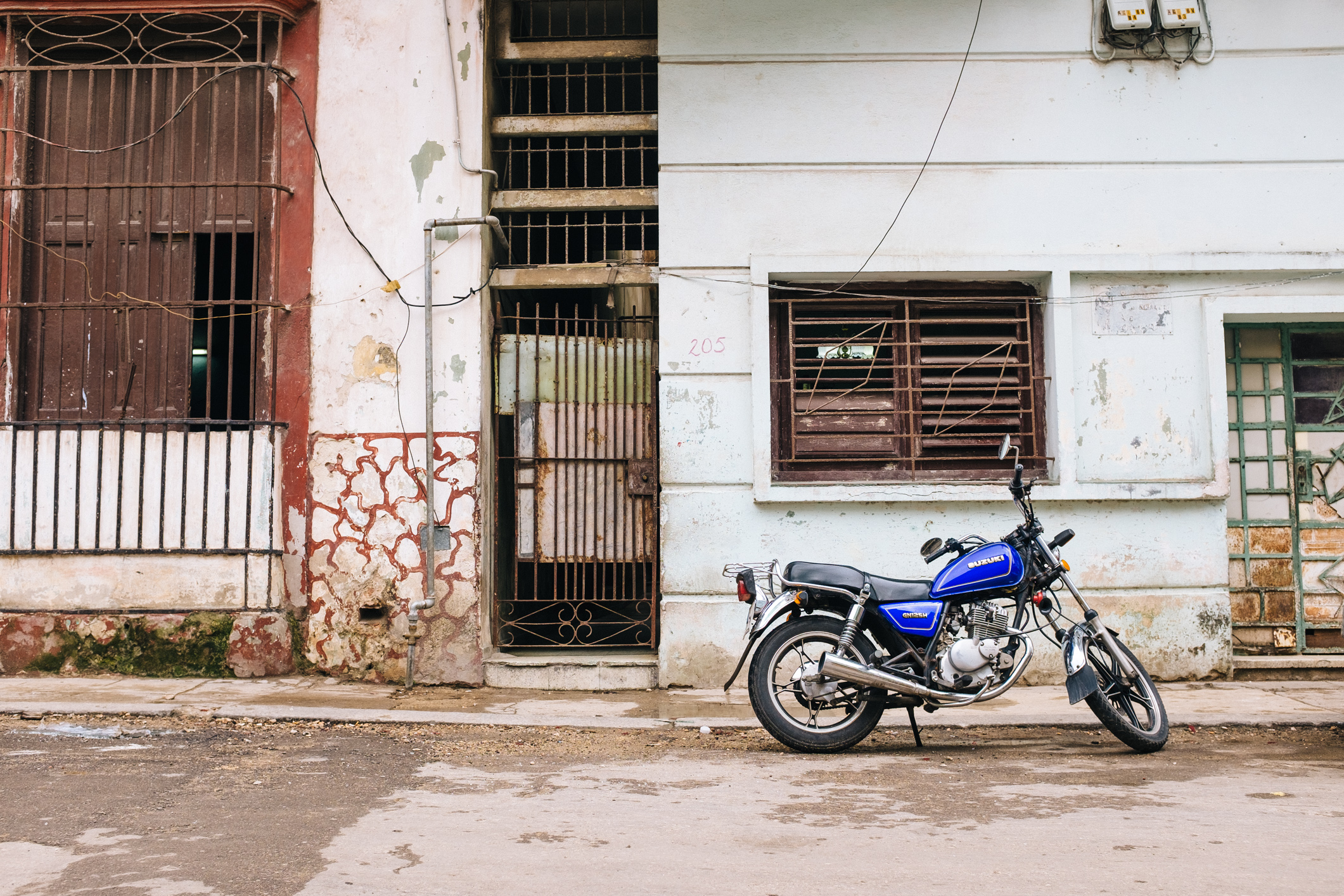 A Suzuki GN125H in Havana. Photo Credit: Adam Nagel